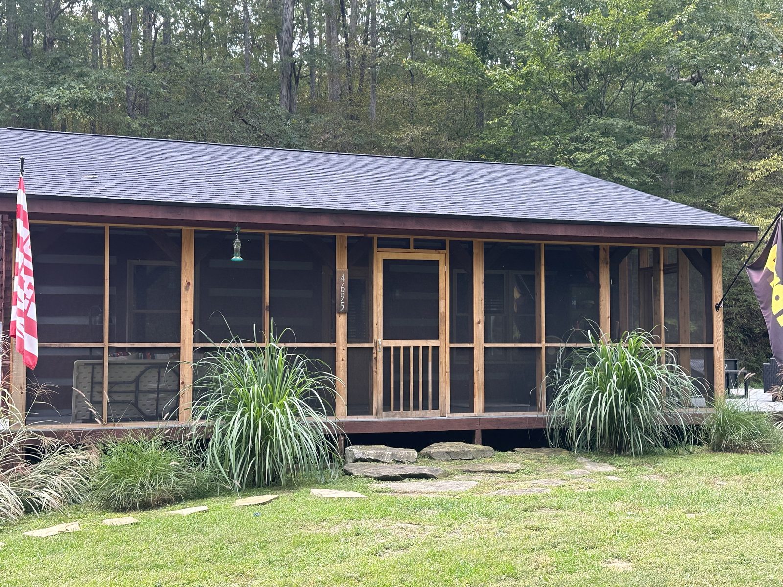 A cedar screened porch on a wooded cabin, sealed inside and out with two coats of clear sealer